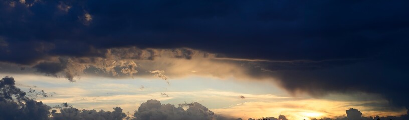 panorama of gray-white clouds at sunset.