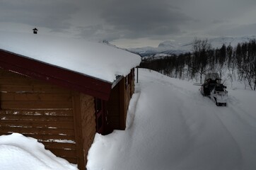 cabin in winter mountain