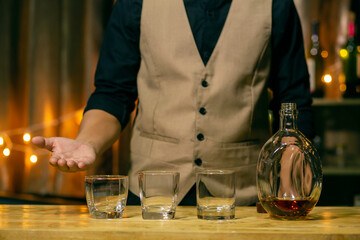 Barman pouring whiskey whiskey glass beautiful night
