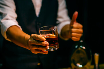Barman pouring whiskey whiskey glass beautiful night