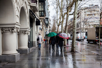 The famous Serrano street on a rainy winter day at Madrid city center in Spain
