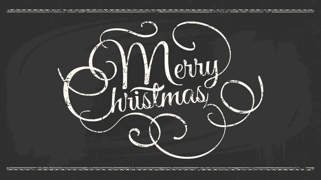 merry christmas sign written with white calligraphy similar to medusa head hand drawn over black chalkboard