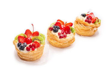 Home made cake with cream and fruits isolated.