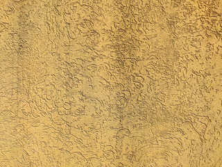 Texture of the yellow plaster bark beetle on the wall. Seamless texture.