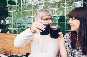 Happy friends cheering at a bar celebrating friendship.Copy space.Happy people concept