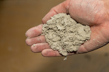 A lump of loose dust in the palm of your hand