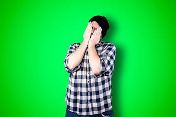 I'm afraid. Fright. Portrait of the scared man. Business man standing isolated on trendy green studio background. Male half-length portrait. Human emotions, facial expression concept