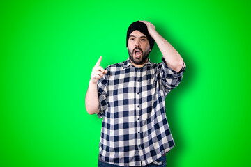 Man over isolated chroma background studio with surprise facial expression