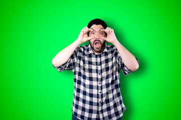 Man over isolated chroma background studio with surprise facial expression