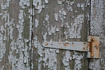 Old wooden surface with traces of paint peeling over time