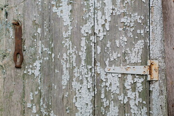 Old wooden surface with traces of paint peeling over time