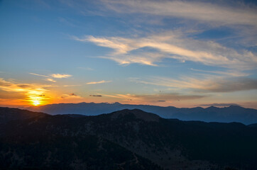 Beautiful mountain landscape with sunset over Taurus Mountains from the top of Tahtali Mountain near Kemer, Antalya, Turkey. 