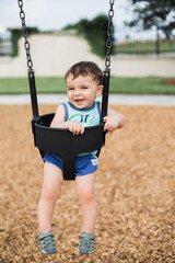 little boy on swing