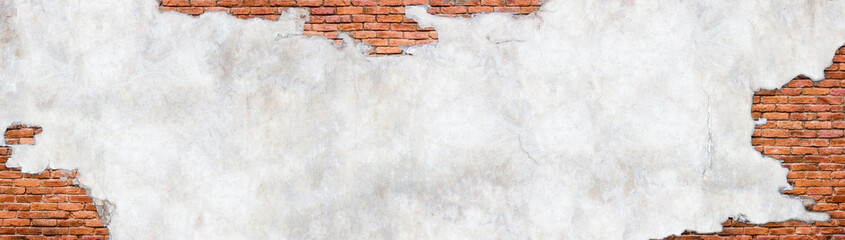 Vintage brick wall background, surface with crumbling plaster.  Old brickwork and destroyed...
