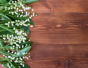 Lilies of the valley on a wooden background. copyspace