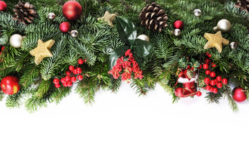 Christmas decorative background border with red bauble decorations, holly berries, spruce and pine cones