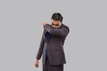 Businessman Sneezing Virus Style. Indian Business Man Sneezing in Elbow.