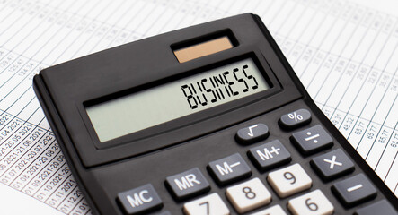 A calculator with the word business on the display
