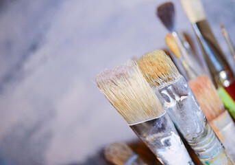 Paint brushes on a blue background