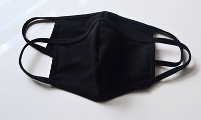 Black protective face masks against COVID-19. Made of cotton.