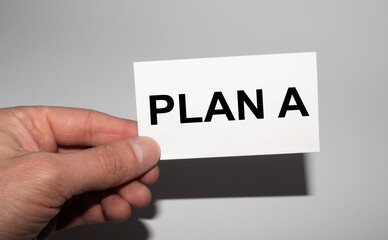Message on the card plan a, in hands of businessman.