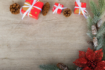 Christmas holidays composition with decorations, presents, pine cones and plants on white wooden board background with copy space for your text. Flat lay, top view