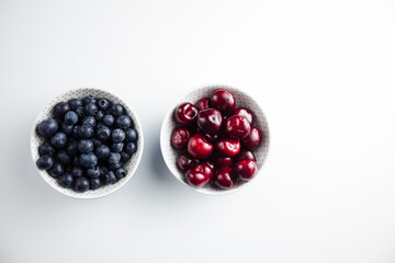 Close-up of cherries and blueberries on a wooden Board. Fresh berries
