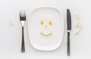 Pills served on plate as a healthy meal