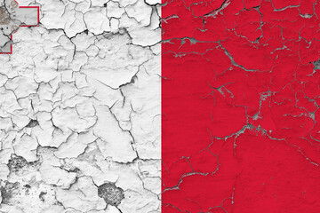 Malta flag close up grungy, damaged and weathered on wall peeling off paint to see inside surface. Vintage concept.