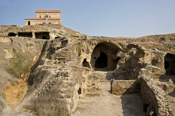 Fototapeta premium Uplistsulis Eklesia (Prince's Church) sits on a hill overlooking the ruins of the ancient monastic cave city of Uplistsikhe, near Gori, Georgia