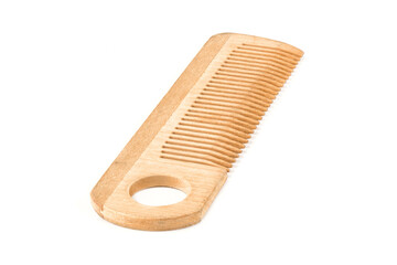 Wooden comb isolated on a white background.