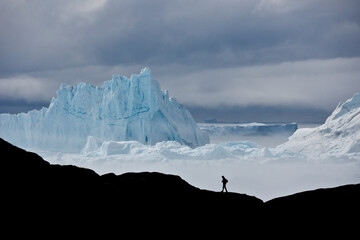 Icebergs piled up in the icefiord, calved from Sermeq Kujalleq glacier, Ilullisat, Disko Bay, West...