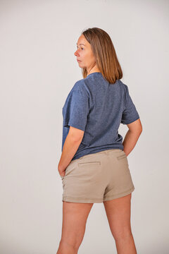 Middle aged female model in shorts and tee shirt