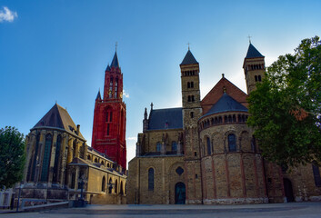 The ancient Vrijthof Square with the Saint Servatius Basilica and the St John Church , Maastricht, Limburg, Netherlands.