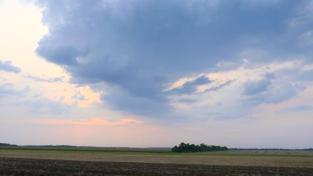 Driving Along Cultivated Farm Field. Sky Horizon over Rural Landscape