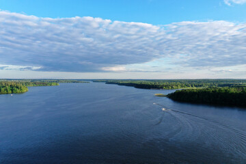 natural landscape with river forest and fantastic clouds in the sky