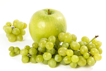 Green grapes and green apple on a white background.