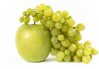 Green grapes and green apple on a white background.