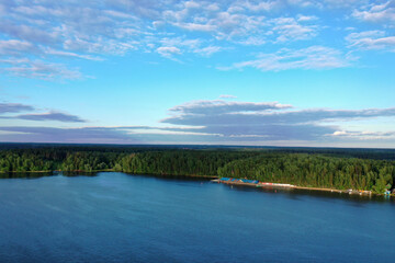 natural landscape with river forest and fantastic clouds in the sky