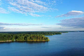 natural landscape with river forest and fantastic clouds in the sky