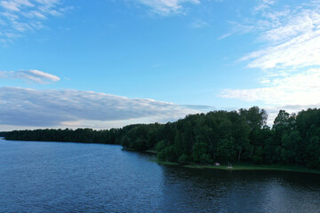 natural landscape with river forest and fantastic clouds in the sky