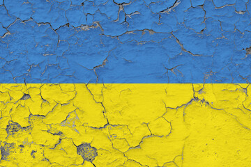 Ukraine flag close up grungy, damaged and weathered on wall peeling off paint to see inside surface. Vintage concept.
