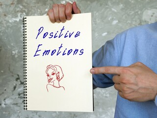 Motivation concept about Positive Emotions with phrase on the piece of paper.