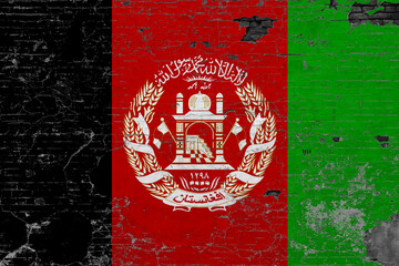 Afghanistan flag on grunge scratched concrete surface. National vintage background. Retro wall concept.