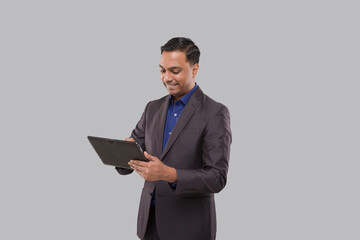 Businessman Using Tablet Green Screen Isolated. Indian Business man with Tablet in Hands. Online Business Concept