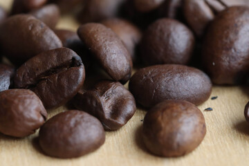Macro photo of freshly roasted aromatic coffee beans. Soft focus.
