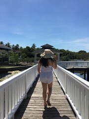 woman walking on bridge summer