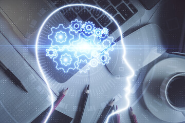 Multi exposure of brain sketch hologram over topview work table background with computer. Concept...