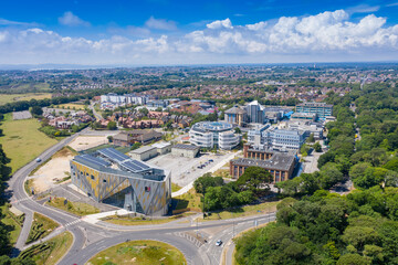 Aerial photo of the Bournemouth University, Talbot Campus buildings from above showing the Arts University Bournemouth, the Student Village, Fusion Building, Medical Centre