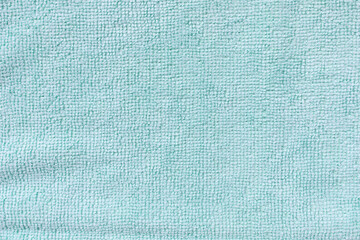 Blue microfiber cloth for cleaning. Cleaning micro fabric towels for dusting and polishing. Domestic household cleaning service concept. Close up, copy space